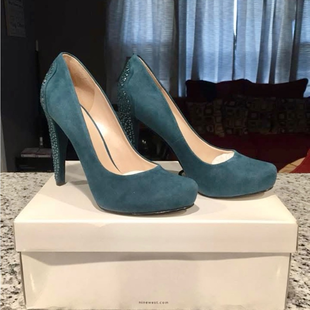 Teal pumps with rhinestones detail on back. Worn once, in very good condition.